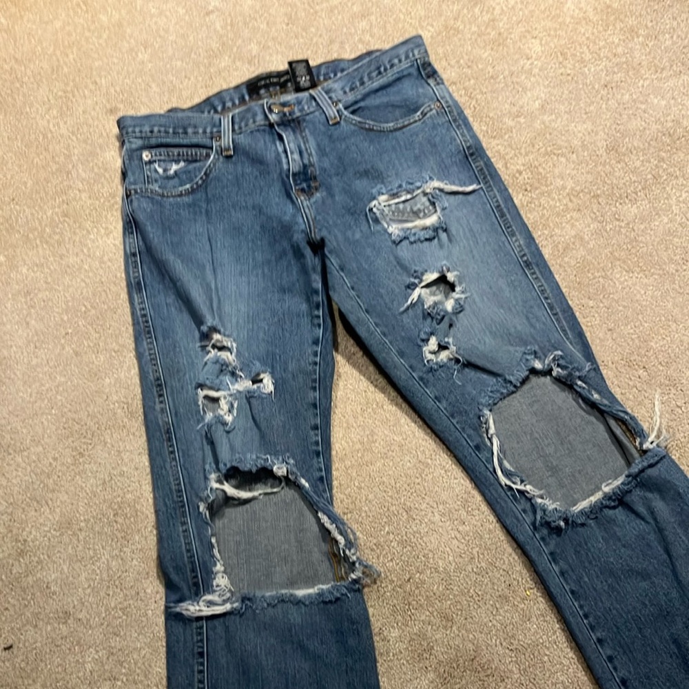 Distressed Calvin Klein flare Blue Jeans